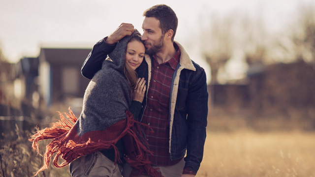 Couple walking closely in the neighborhood 