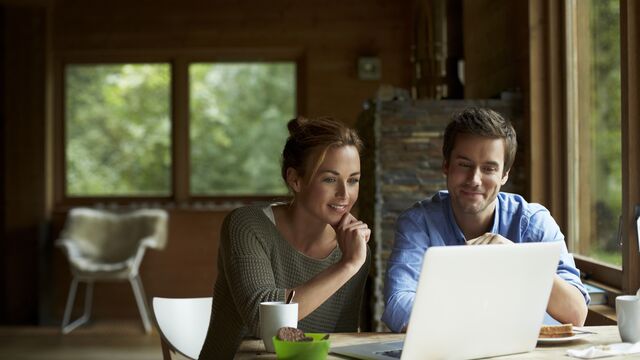 young couple looking at laptop 2 small overlay