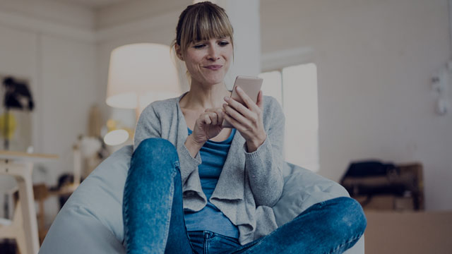 Woman using mobile phone.