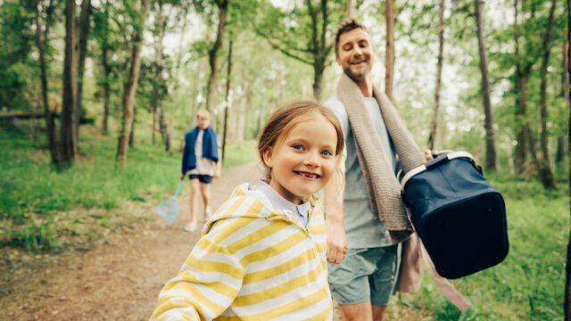 Man is walking to the beach with girl and boy - small
