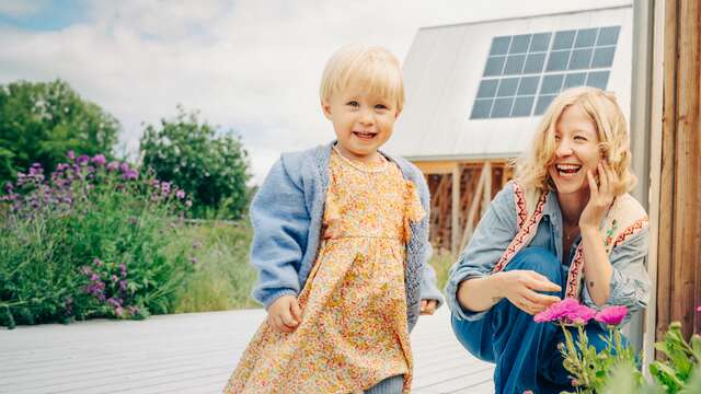 Advertising - Mother and girl looking at flowers - small