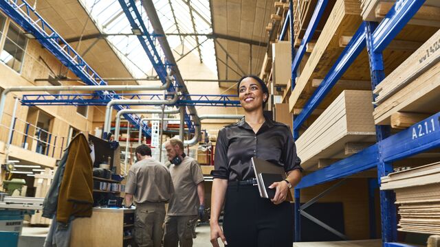 Next generation woman walking at manufacturing SMALL