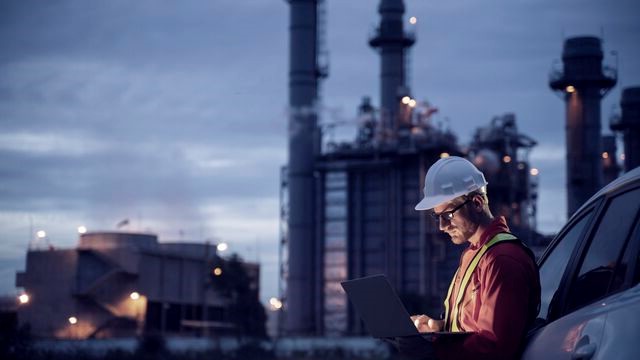 Petrochemical engineer using smart tablet