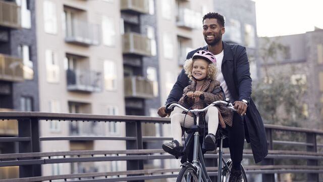 Dad cycling with girl - Small