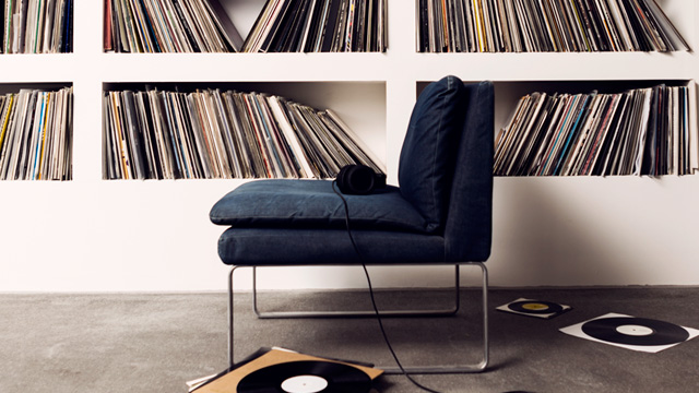 Blue sofa in front of record collection