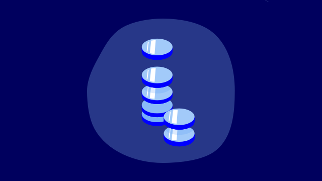 stack of coins on blue background