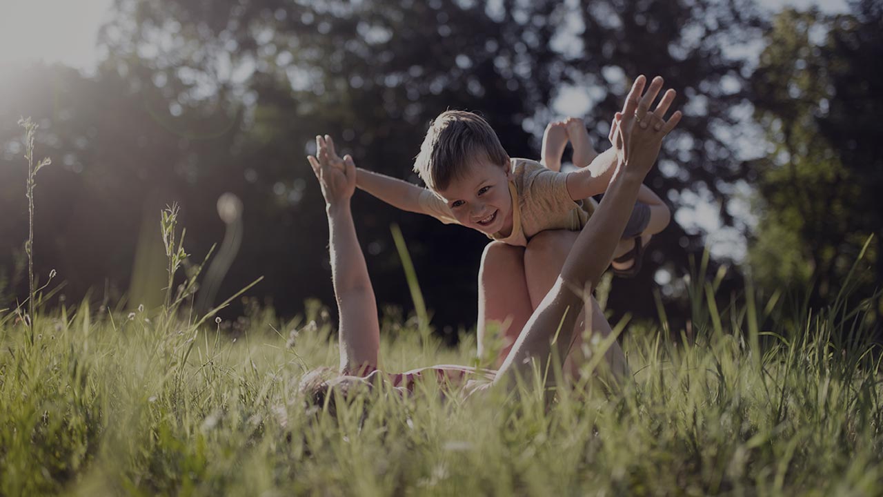 joyous boy lifted in the air