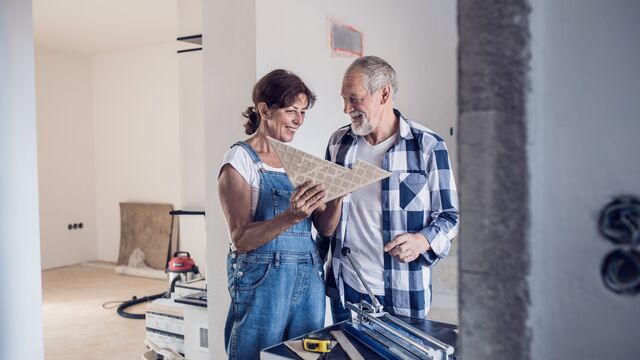 Renovation - couple checking the floor material - small